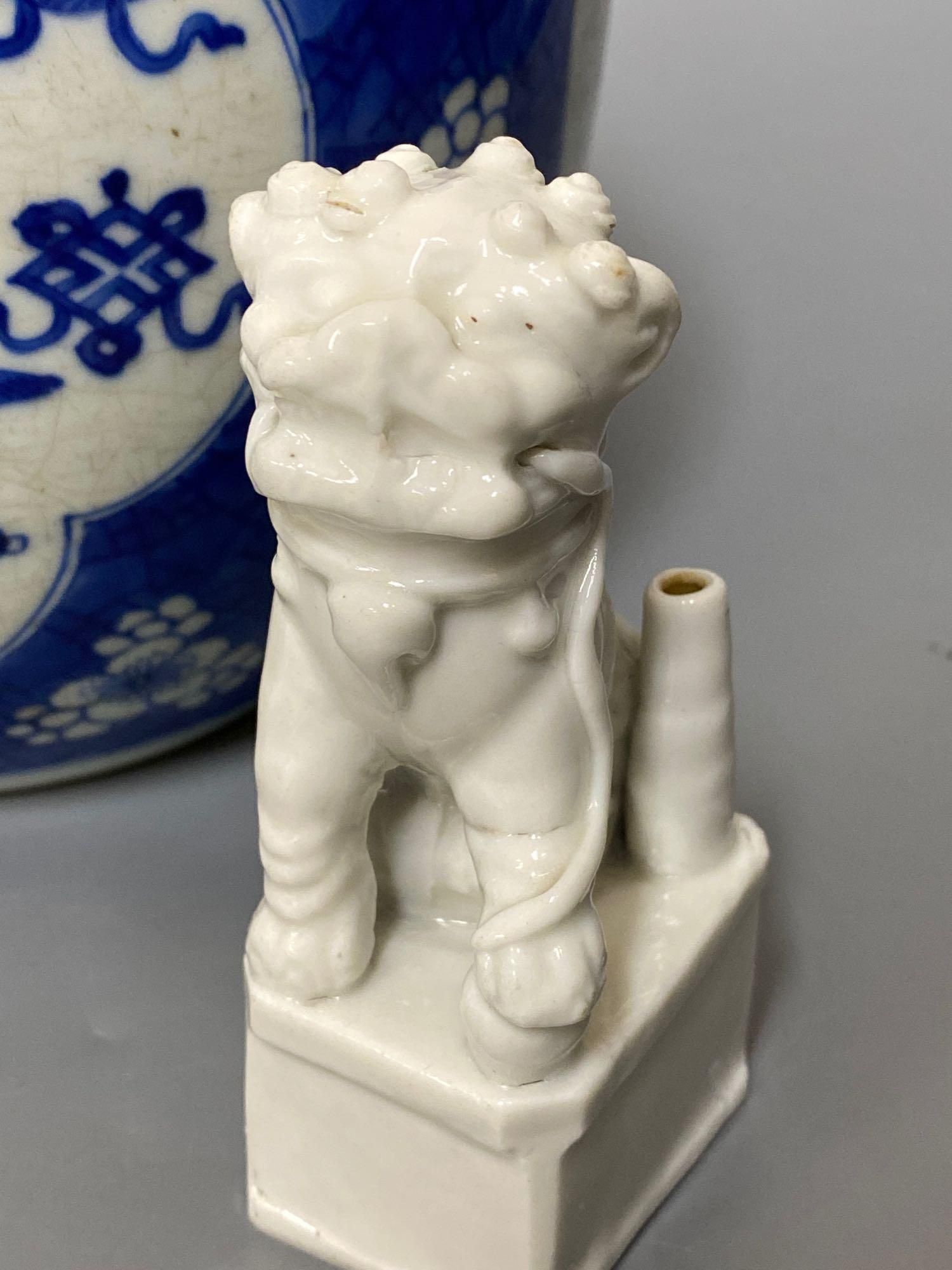 A Chinese blue and white ginger jar and cover, Kangxi period, 22.5cm and two blanc de chine dogs of fo